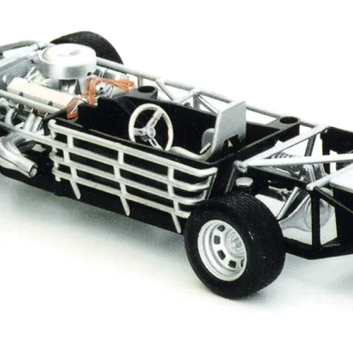 Model of a partially assembled car chassis with exposed framework, showing engine, steering wheel, and other components against a plain background.